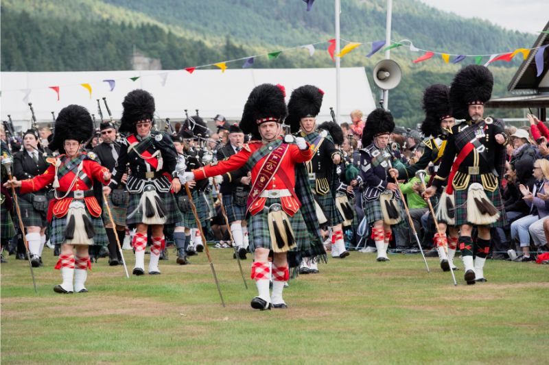 Pipe band marching at the Ballater Highland Games