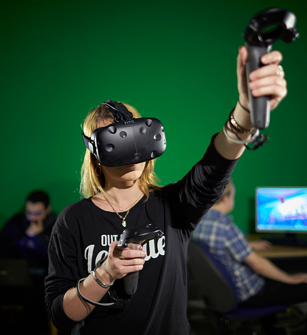 Young woman using Virtual Reality equipment