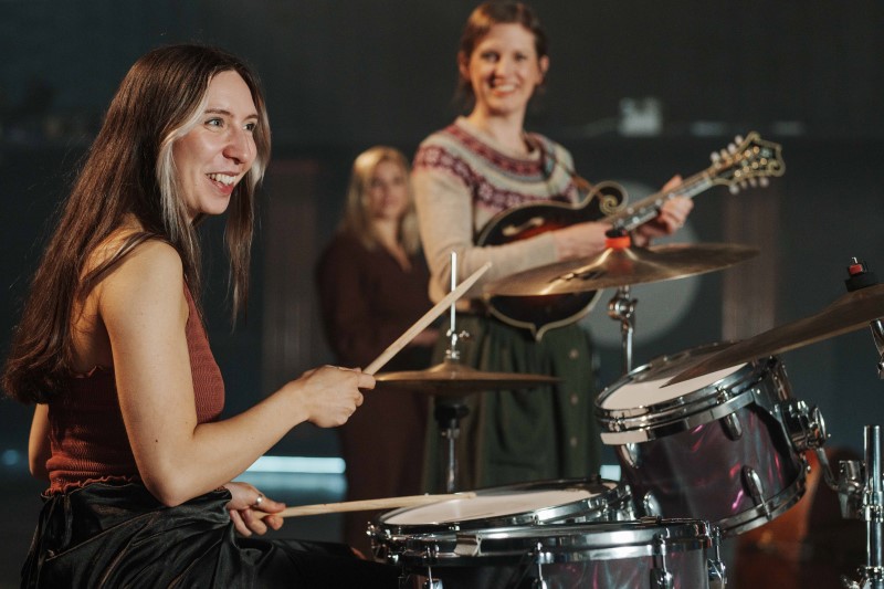 Female and non-binary collective Hen Hoose playing musical instruments 