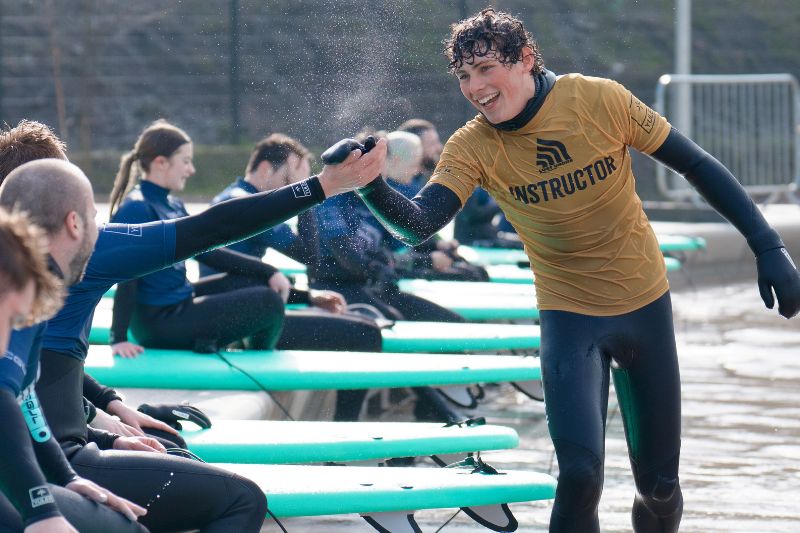 Instructor teaching surfing at Lost Shore Surf Resort in Scotland 