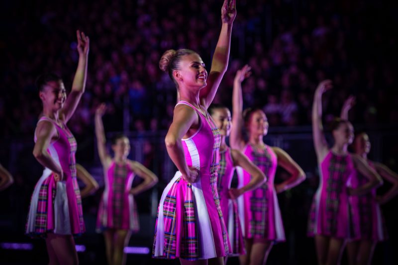 Highland dancers smiling and dancing at The Royal Edinburgh Military Tattoo