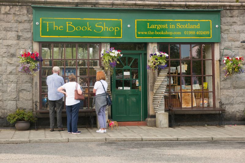 People standing outside of the largest second-hand book shop in Scotland, located in Wigtown. 