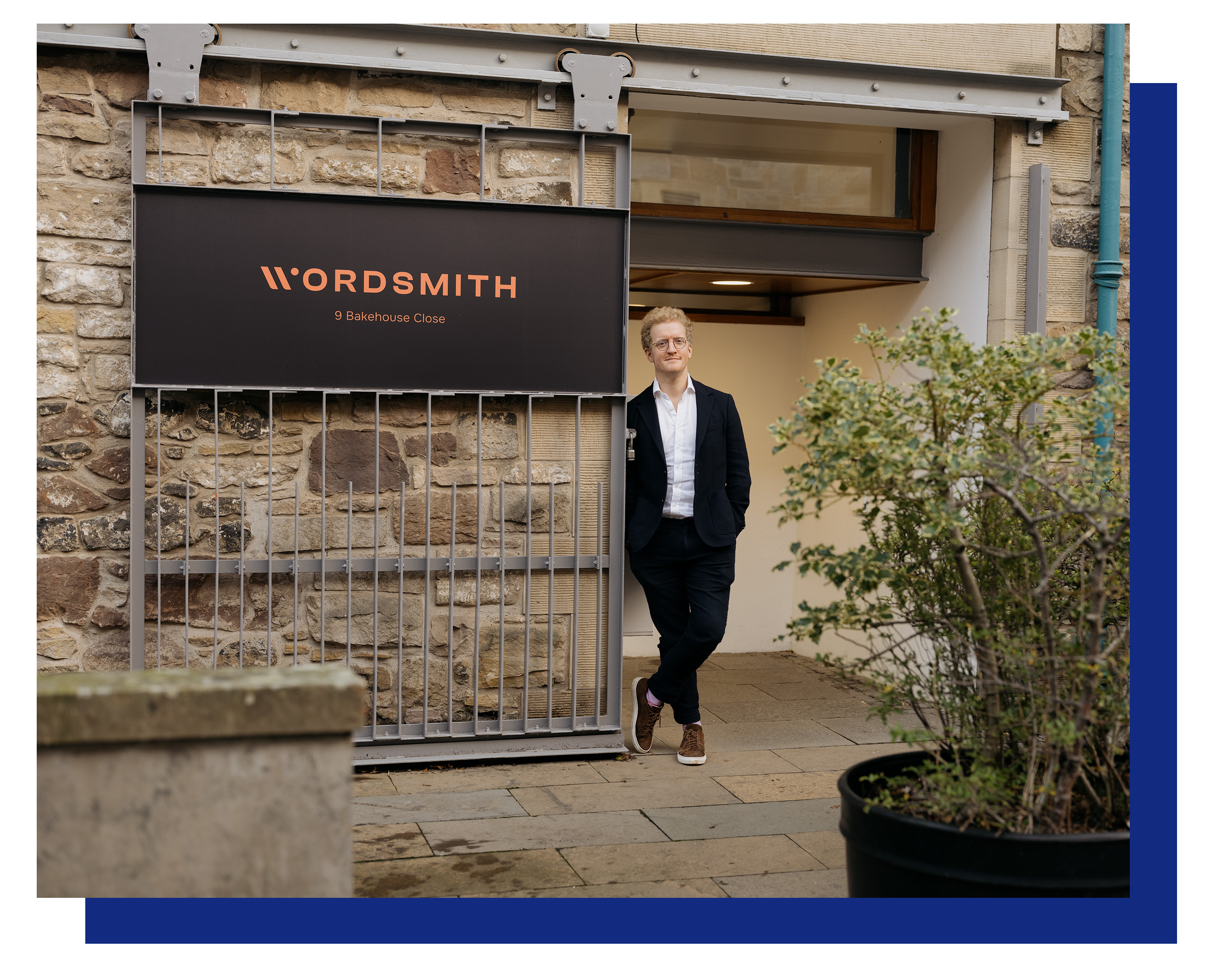 Ross McNairn, CEO of Wordsmith AI, standing outside the Wordsmith AI building.
